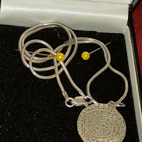 Necklace with 9.25 silver chain and Phaistos disc like new
