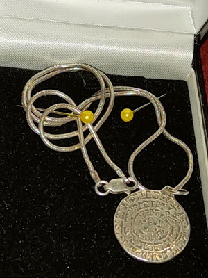 Necklace with 9.25 silver chain and Phaistos disc like new