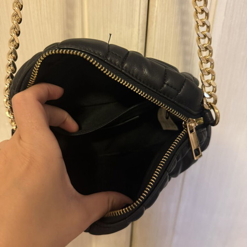 Women's black crossbody bag with gold chain