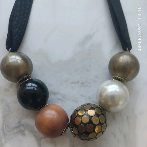 Accessorize necklace used with black thick ribbon and large beads