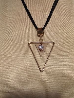 Pendant like new metal with 4-row black and gold chain with rhinestones