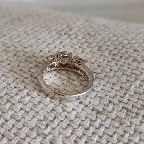 Trilogy silver plated ring used with zircon and heart motifs