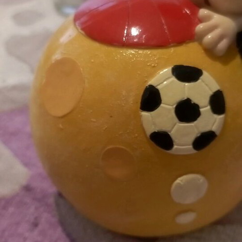 Ceramic piggy bank used with bottom opening