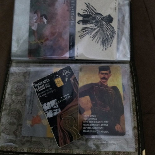 Collectible old phone cards used with album