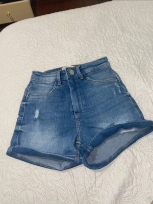 Kids' blue denim shorts used with pockets