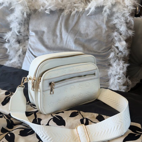 White bag with gold details and unique design, new