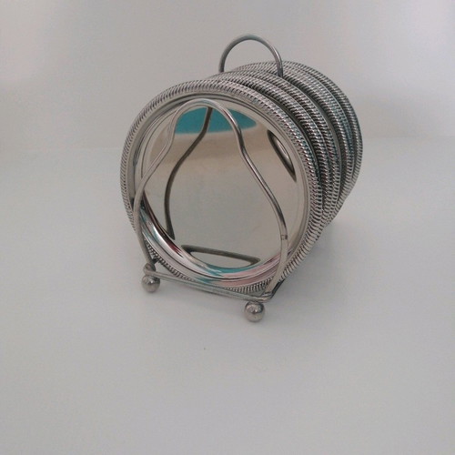 Vintage silver coaster set with elegant stand, like new