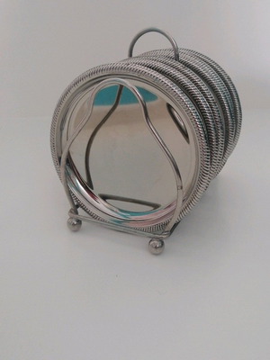 Vintage silver coaster set with elegant stand, like new