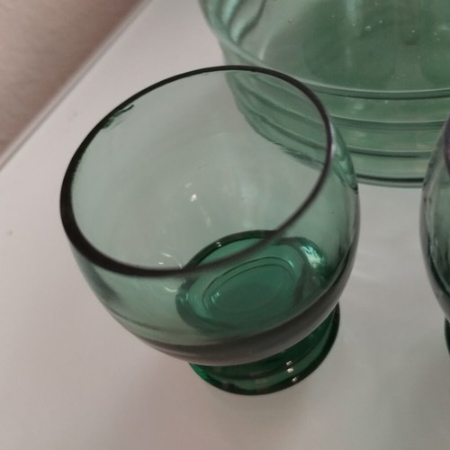 Vintage decanter set with 5 green glass shot glasses used