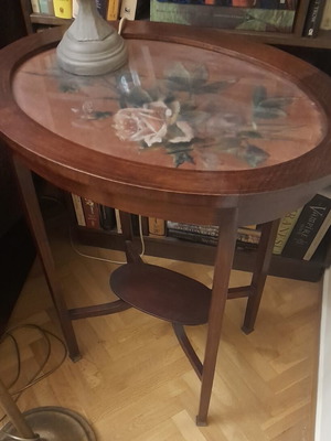 Vintage side table with glass top and floral design used