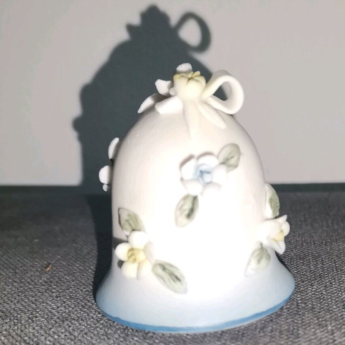 Ceramic bell used with embossed flower designs