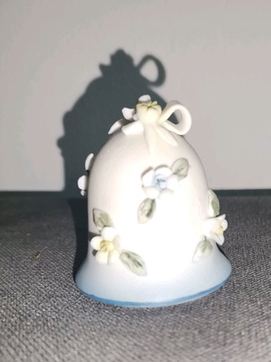 Ceramic bell used with embossed flower designs