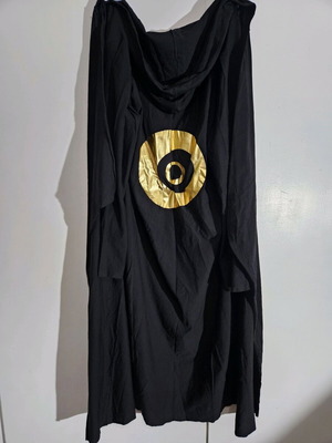 Long cardigan like new with gold eye on back, black size M