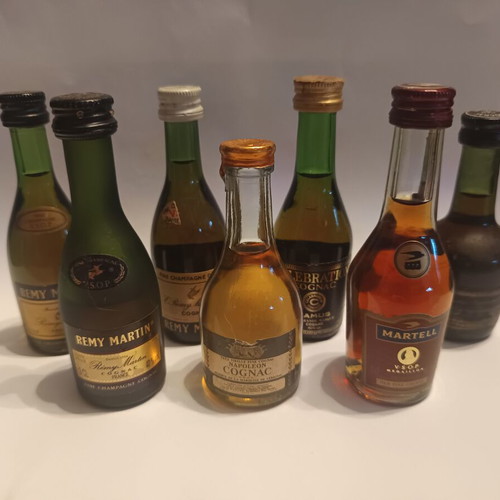 7 miniature cognac bottles, sealed, pack