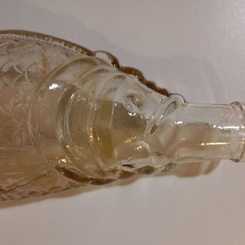 Glass bottle in fish shape used