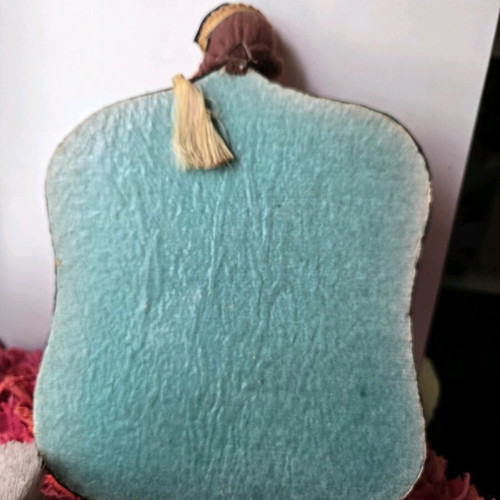 Antique mirror with velvet frame and doll, used 1950-1965