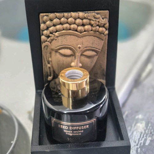 Decorative Buddha base like new with black glass bottle 100ml