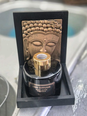Decorative Buddha base like new with black glass bottle 100ml