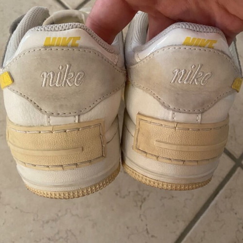 Nike athletic shoes used, white and yellow, size 38