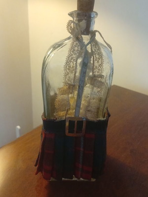 Vintage whiskey bottle used, Scottish kilt design