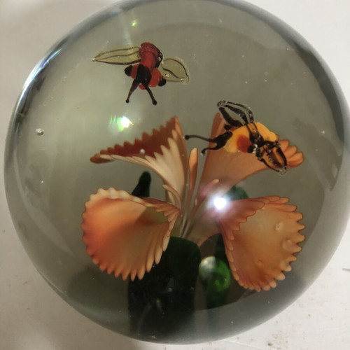 Handblown glass dome paperweight with stylized bees
