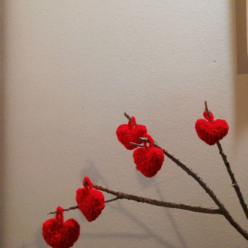 Knitted hanging red hearts like new