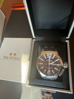 TW Steel watch used with brown strap and date display