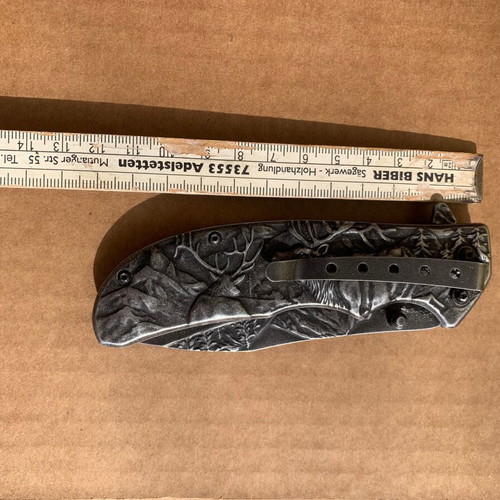 Folding knife with animal design used with blade lock