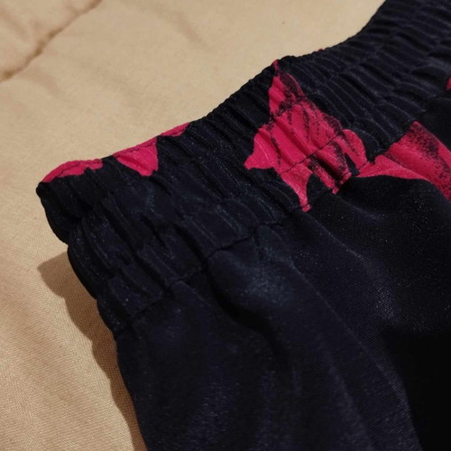 Skirt black shiny with red flowers new