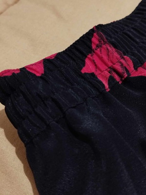 Skirt black shiny with red flowers new