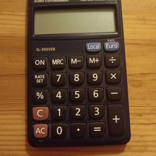 Casio calculator used, solar powered with minor screen damage