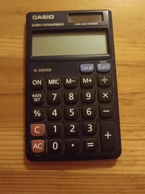 Casio calculator used, solar powered with minor screen damage