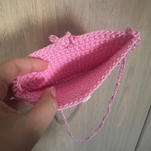 Children's pink knitted bag with heart and button