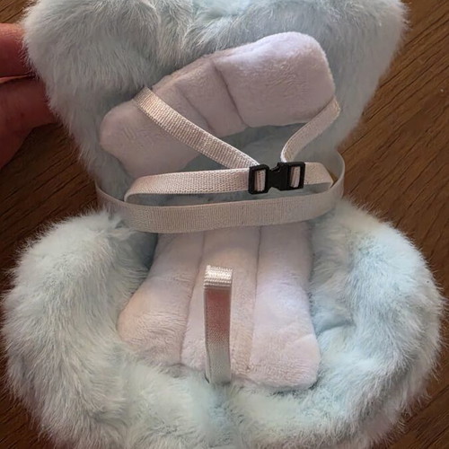 Labubu doll with car seat attachment