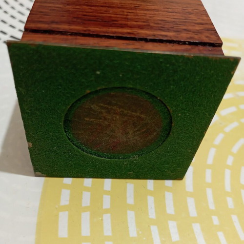Vintage miniature manual coffee grinder with wooden body and brass hopper