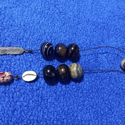Handmade Greek begleri with natural agate beads and decorative feather charm