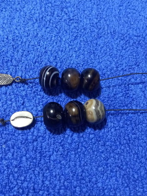 Handmade Greek begleri with natural agate beads and decorative feather charm