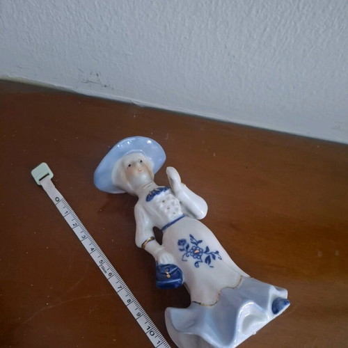 Retro porcelain woman figurine with gold details like new