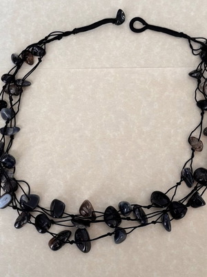Triple necklace with dark real stones on black cord like new