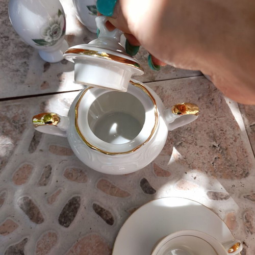 Porcelain tea set collectible with gold details and small vases like new