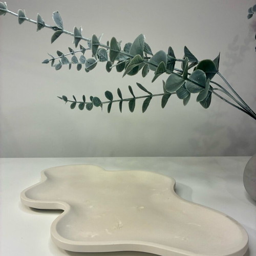 Handmade ceramic tray with organic shape and minimal design