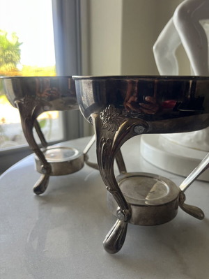 Vintage metal food warmer set with decorative legs and handles