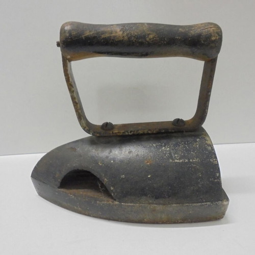 Old cast iron iron with internal heating plate used
