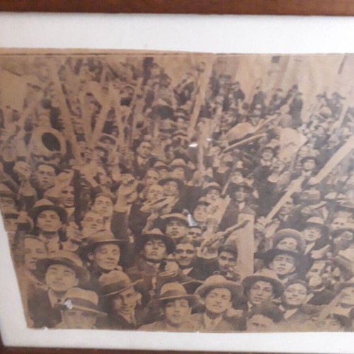 Newspaper scrap used from 1932 student rally in wooden frame