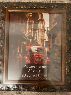 Ornate wooden frame, 20.3cmX25.4cm. Unused, can be hung or displayed.
