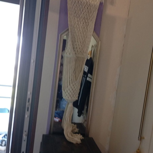 Two knitted wall hangers for pots, different sizes