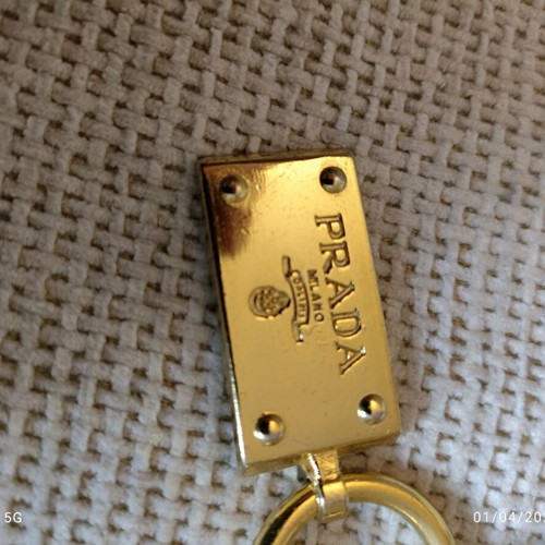 Authentic Prada gold key ring unisex like new