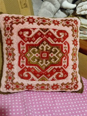 Handmade vintage folk figure pillow used