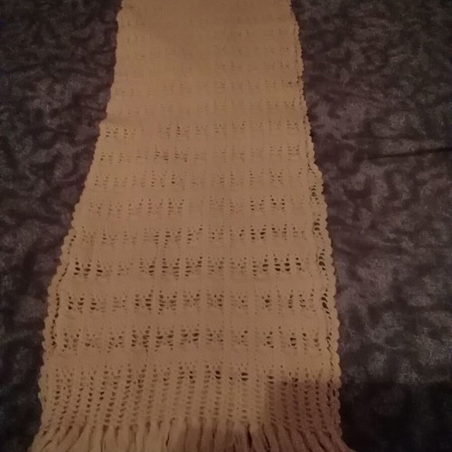 Knitted scarf handmade in soft yellow color with fringes