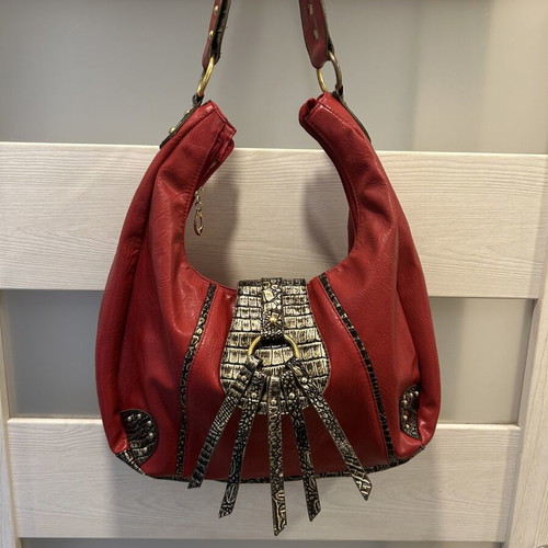 Red hobo shoulder bag like new with decorative details